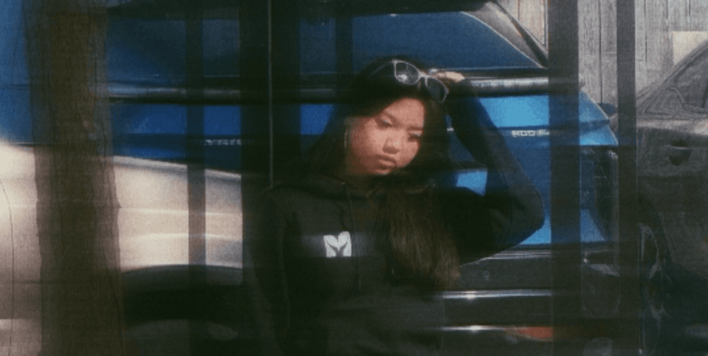 Person wearing Mkora Collective hoodie